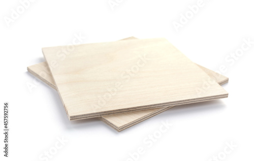 Plywood boards isolated at white background. Stack of plywood pieces photo