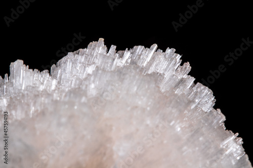 Macro mineral Scolecite stone on a black background photo