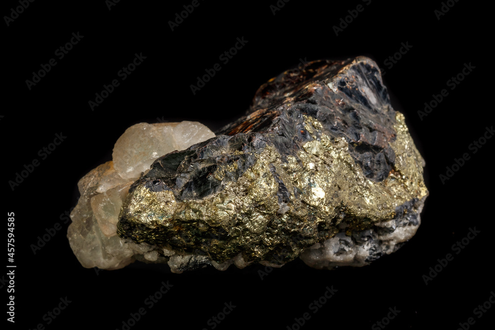 Macro of a mineral stone Sphalerite with fluorite and pyrite on a black background close up Macro of a mineral stone Sphalerite with fluorite and pyrite on a black background close up