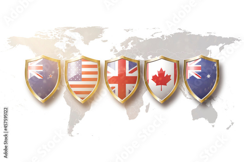 Australia, us, great britain,canada, and new zealand flags in golden shield on world map background.5 eyes alliance. photo