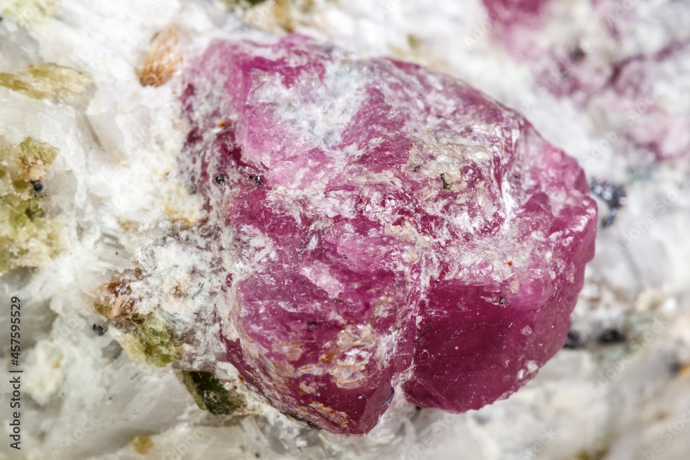 Macro mineral stone Ruby in rock on white background Macro mineral stone Ruby in rock on white background