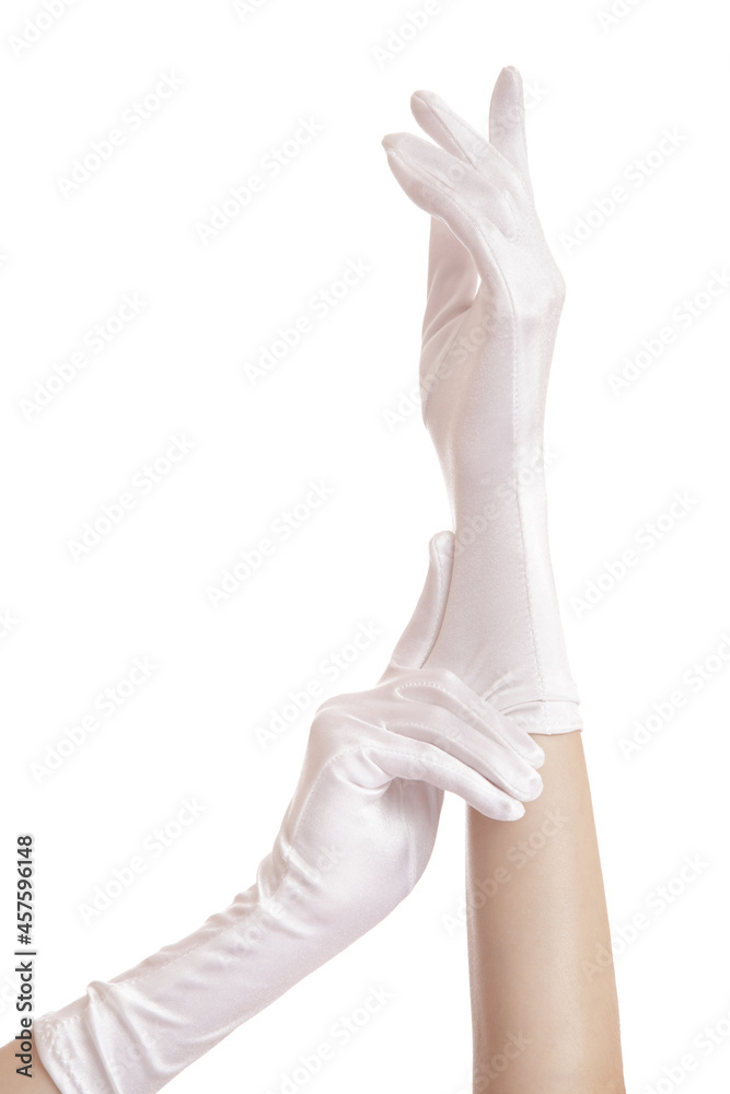 woman hands pull on white gloves. isolated on white background woman hands pull on white gloves. isolated on white background