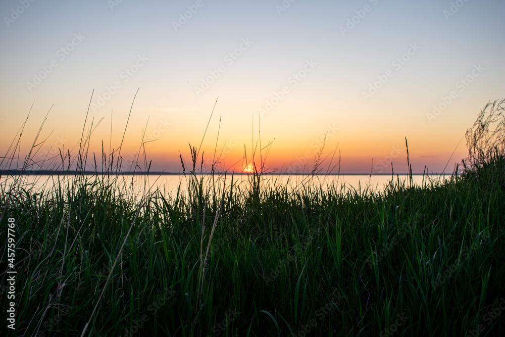 Beautiful sunset over the river in summer Beautiful sunset over the river in summer