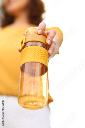 Healthy eating. Water balance in the body. A bottle of water in hands