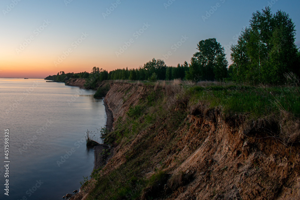 Beautiful sunset over the river in summer