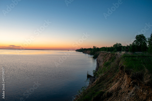 Beautiful sunset over the river in summer © Igor