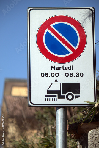 an Italian road sign by day
