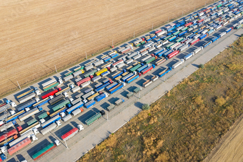 Trucks in line at the loading terminal. Transportation of goods by cars.