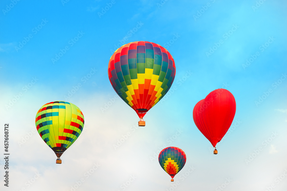 Four bright multicolored balloons against blue sky Four bright multicolored balloons against blue sky