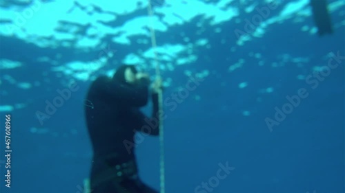 Wallpaper Mural free diver trying to blast ears, defocus to focus. Freediving is a sport when a person dives into sea water while holding his breath. An extreme type of underwater diving to a depth without Torontodigital.ca