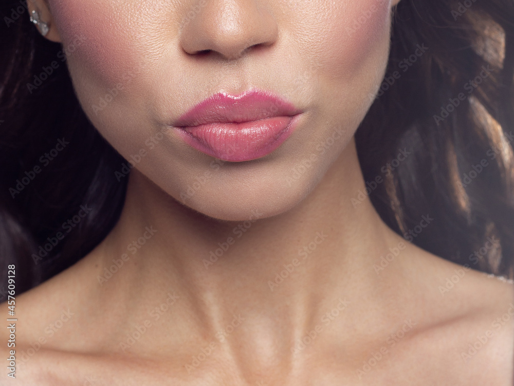 Close-up perfect lip makeup beautiful female mouth. Plump sexy full lips. Macro photo face detail. Perfect clean skin, fresh lip make-up. Sweet pink lipstick, magenta color. Valentine's day style Close-up perfect lip makeup beautiful female mouth. Plump sexy full lips. Macro photo face detail. Perfect clean skin, fresh lip make-up. Sweet pink lipstick, magenta color. Valentine's day style