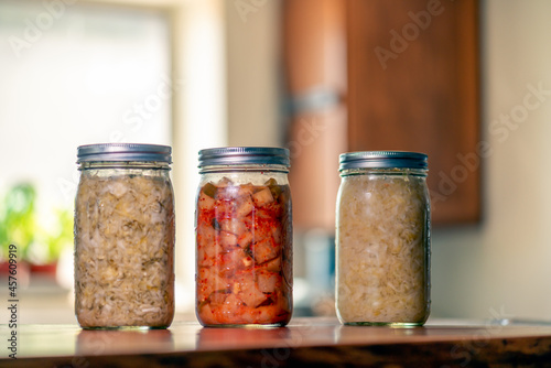Obraz na plátně Sauerkraut, Dill kraut and kimchi in mason jars in home kitchen