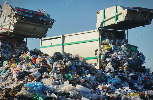 Garbage truck unloading at the dump