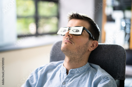 Tired Unhappy Businessperson Sleeping In Office