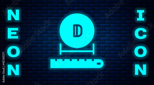 Glowing neon Diameter icon isolated on brick wall background. Vector