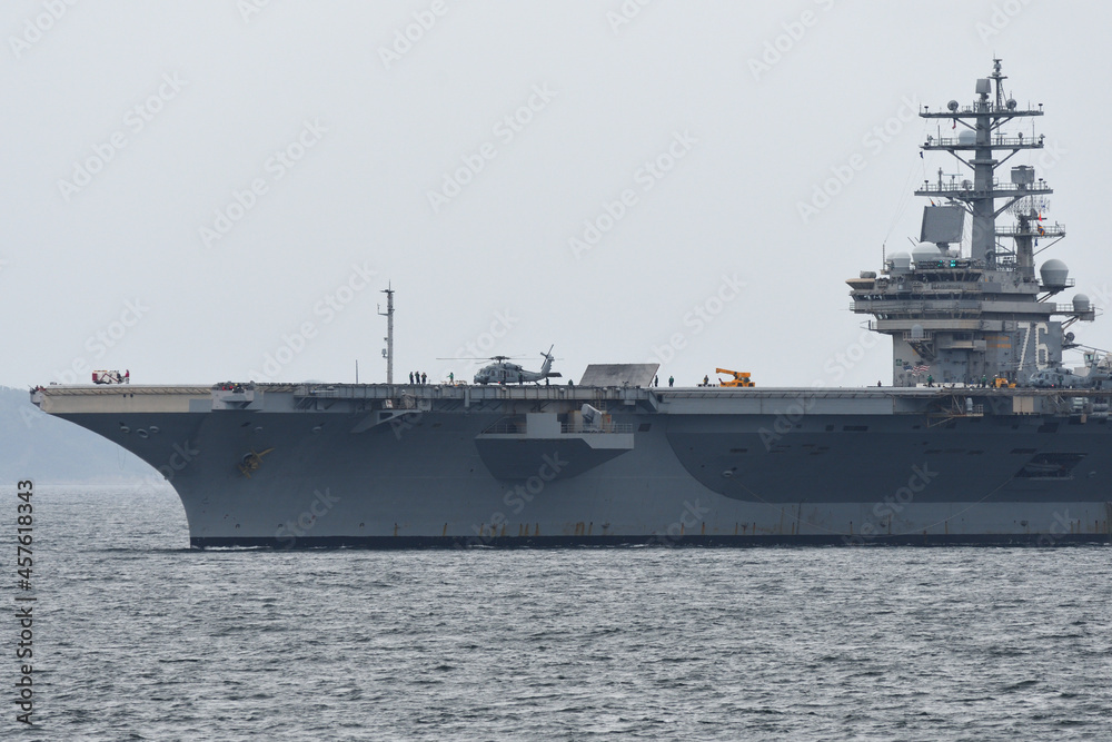 United States Navy aircraft carrier USS Ronald Reagan sailing in Tokyo Bay.