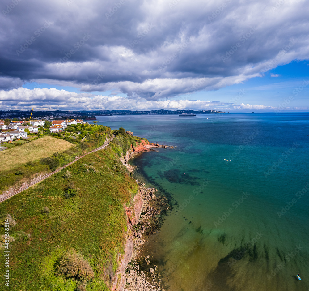 Fototapeta premium Cliffs over Broadsands Beach from a drone, Paignton, Devon, England, Europe