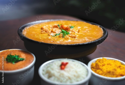 typical Brazilian food, shrimp moqueca with farofa rice and pirão. Salvador Bahia