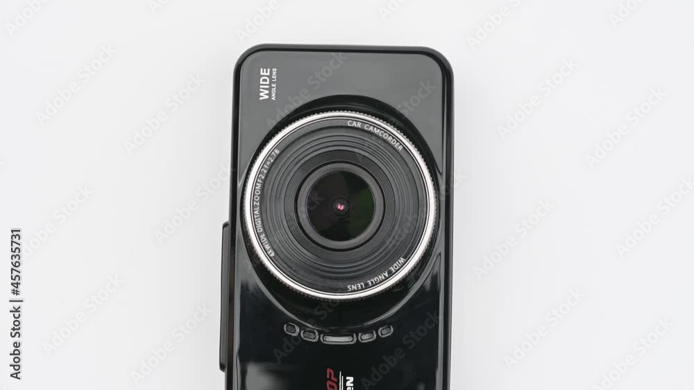 camcorder dashboard security car camera or dashcam with hand holding isolated on white background. camcorder dashboard security car camera or dashcam with hand holding isolated on white background.