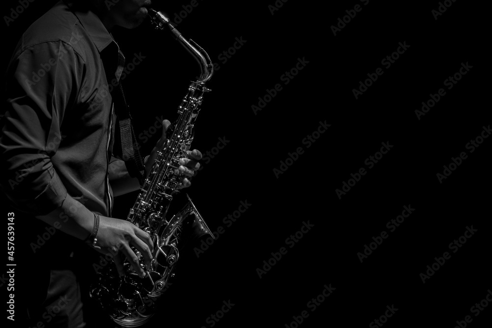 Obraz premium Abstact, musician playing on saxophone, Black and white copy space for text