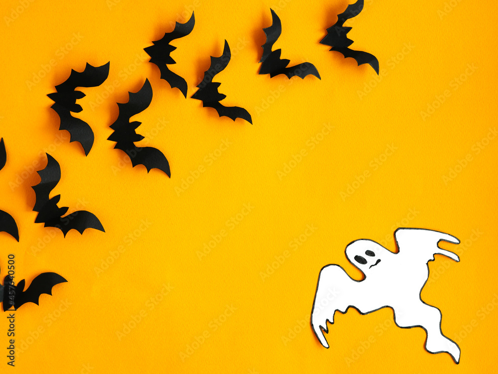 Halloween background. Bats and ghost on an orange background. Smooth layout. Halloween background. Bats and ghost on an orange background. Smooth layout.