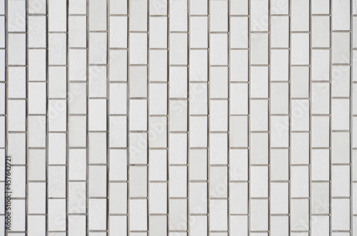 Luxury white brick tile wall texture background. Close up of stylish brick tile wall. 