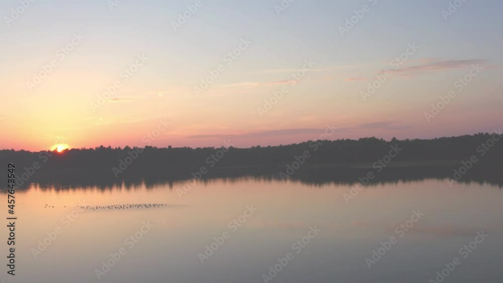 Countryside dramatic and colorful sunset flight over a forest lake, aerial shot on a drone. High quality 4k footage Countryside dramatic and colorful sunset flight over a forest lake, aerial shot on a drone. High quality 4k footage