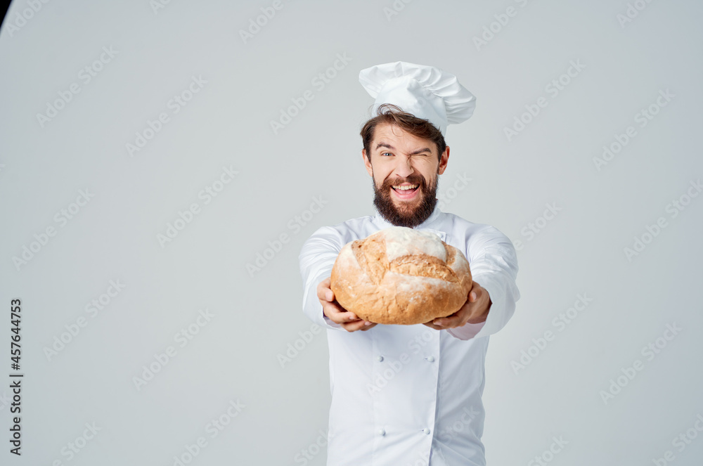 bearded man chef with bread in hand isolated background bearded man chef with bread in hand isolated background
