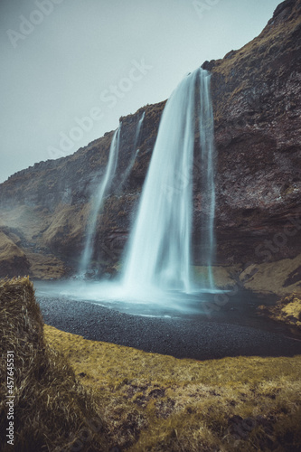 Beautiful view of Seljalandsfoss in Iceland on summer morning. View in front the water curtain of this majestic waterfall.