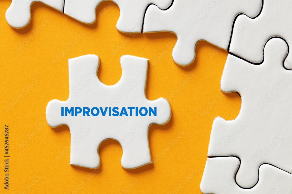 The word improvisation written on a puzzle piece apart form the assembled pieces. Improvising in business decisions - obrazy, fototapety, plakaty 