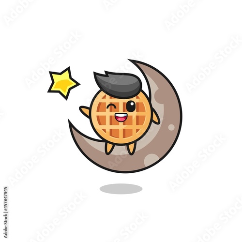 illustration of circle waffle cartoon sitting on the half moon © heriyusuf