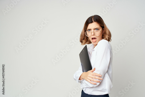 Business woman in white shirt documents office manager