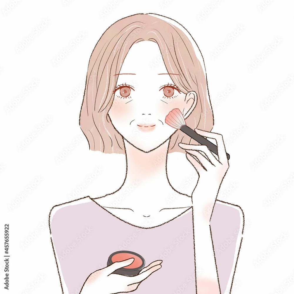 チークを塗る中年女性 チークを塗る中年女性
