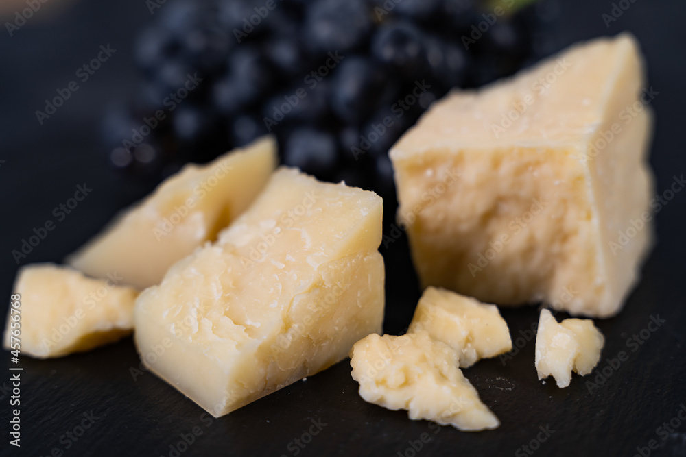 delicatessen cheese with grapes, top view. Close-up delicatessen cheese with grapes, top view. Close-up