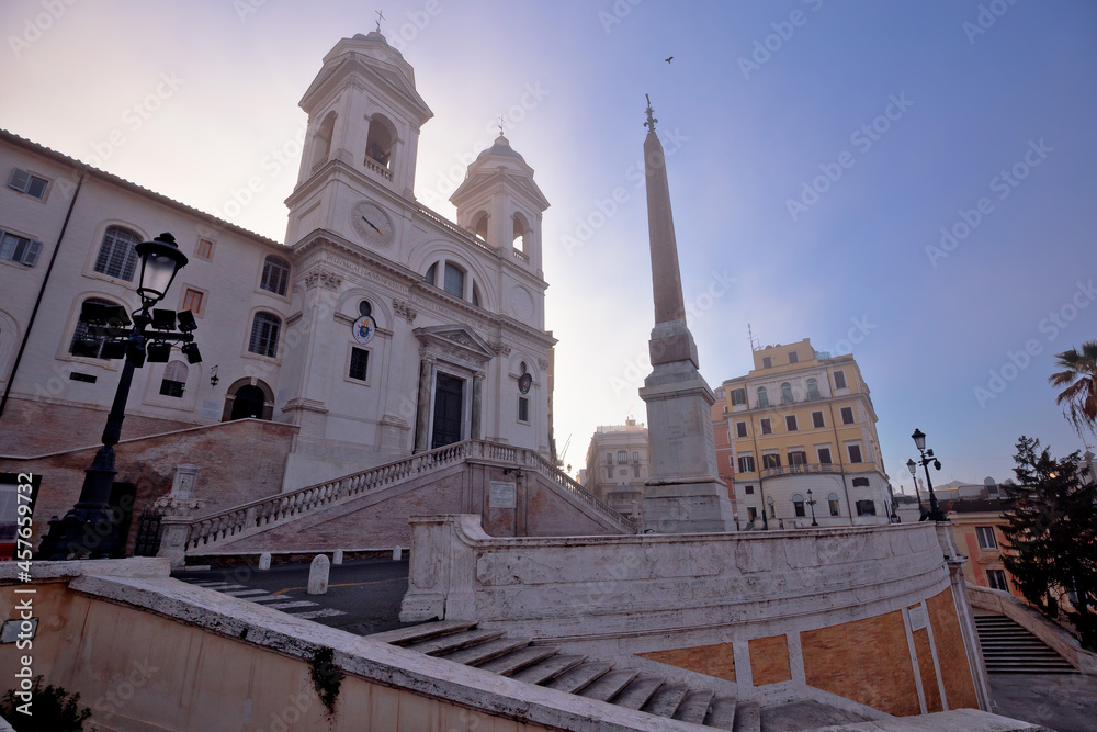 The church of the Santissima Trinità dei Monti above Spanish steps in Rome morning sunrise view