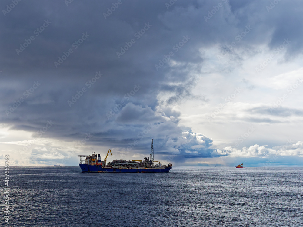 Dark Clouds forming a Storm Front over the Alvheim FPSO in the Norwegian North Sea Sector in early May. Dark Clouds forming a Storm Front over the Alvheim FPSO in the Norwegian North Sea Sector in early May.