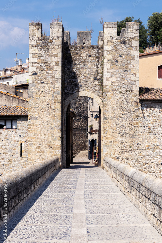 medieval bridge in the town of besalu in girona a sunny summer day