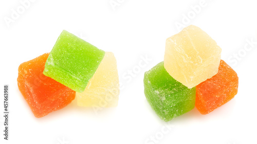 Pile of multi-colored pineapple sweets isolated on white photo
