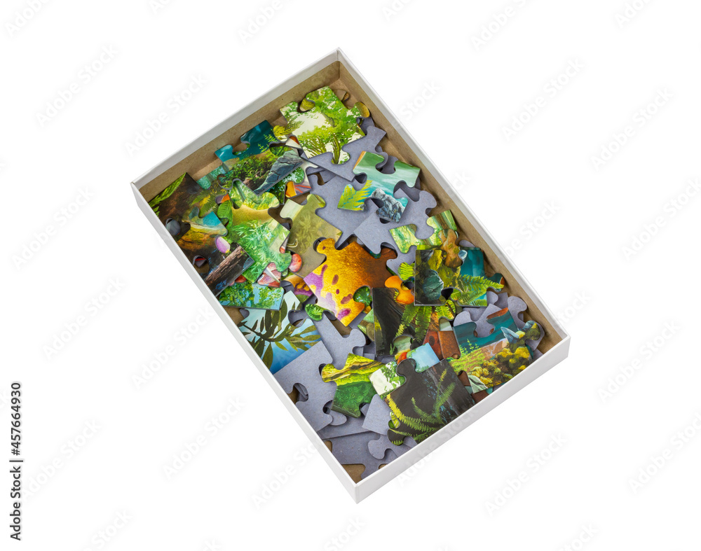 Box with puzzles on a white background. Children's puzzle. Isolate on white. Box with puzzles on a white background. Children's puzzle. Isolate on white.