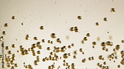 Close-up of champagne bubbles background.