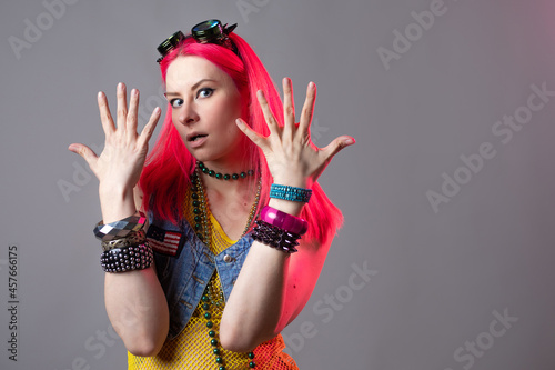 Canvas-taulu Futuristic fashion, a young bright and attractive woman with pink hair,