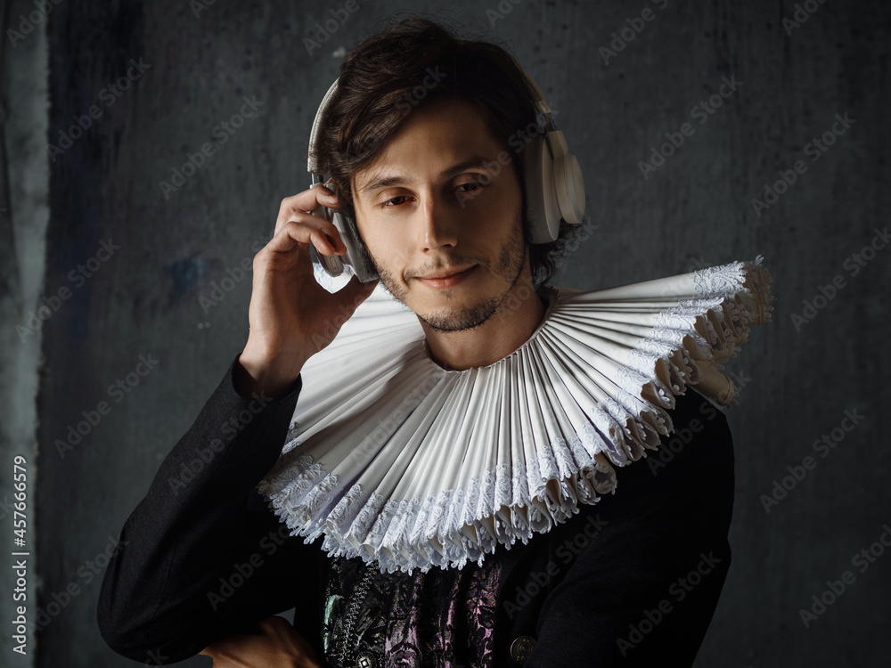 Classics are eternal, art is timeless. A young man in a medieval collar and suit Classics are eternal, art is timeless. A young man in a medieval collar and suit