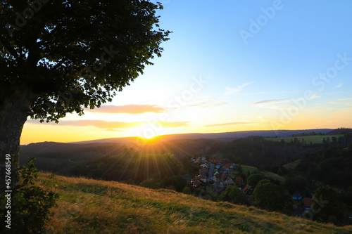 Sunset from the bell tower mountain to Sankt Andreasberg, Harz mountains - Germany