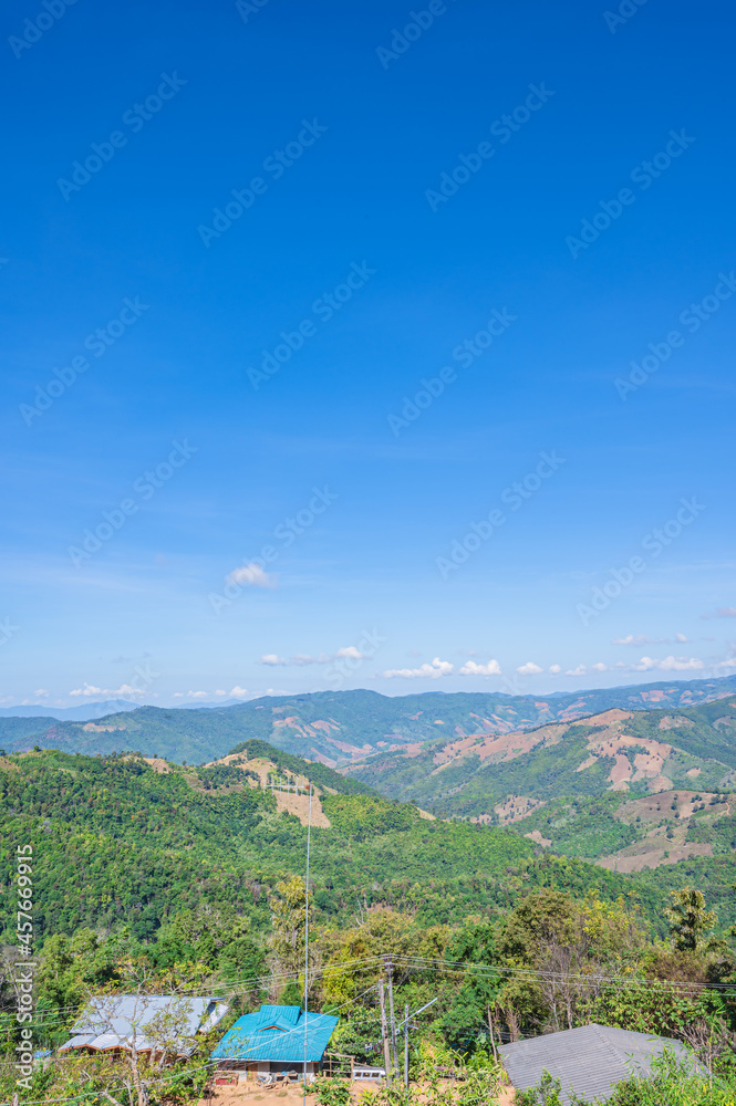 Naklejka premium Beautiful mountain view and blue sky on doi sky at nan province.Nan is a rural province in northern Thailand bordering Laos