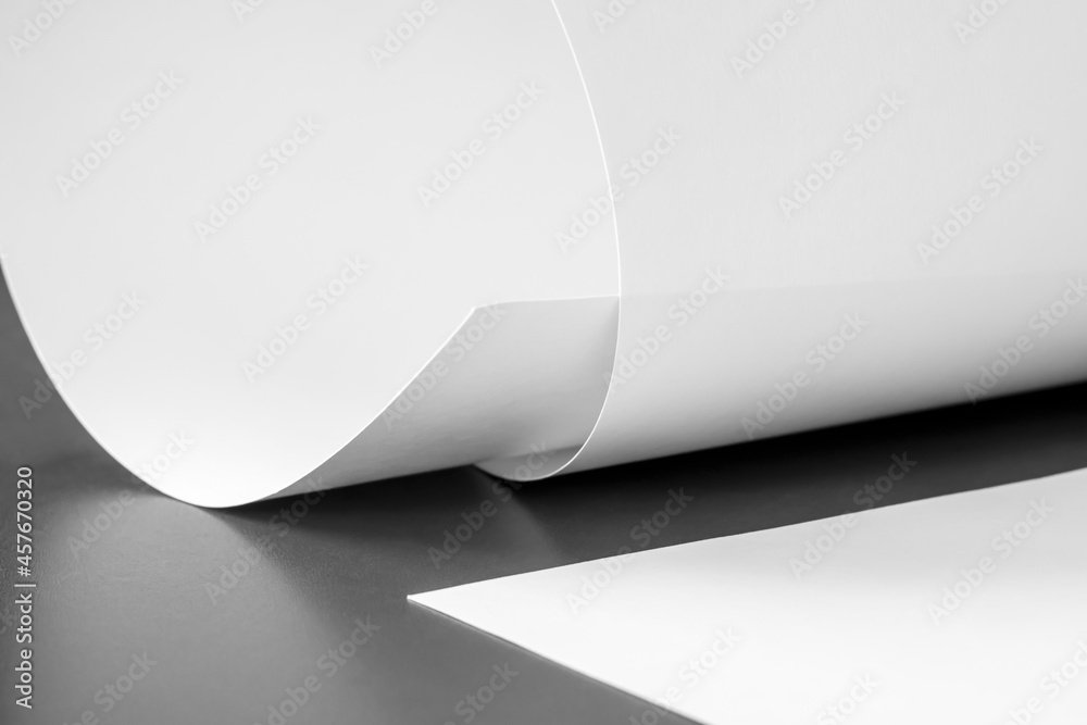 Large sheets of paper on the table. Black and white image. Large sheets of paper on the table. Black and white image.