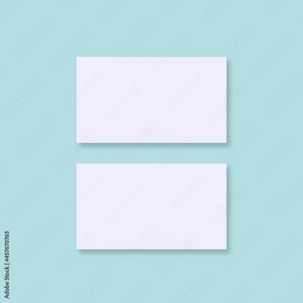 Business Card Mockup Over Flat Blue Background
