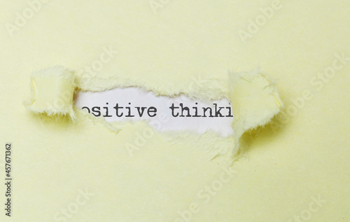 Positive thinking concept. Inspirational words on yellow paper torn. Motivational business concept.