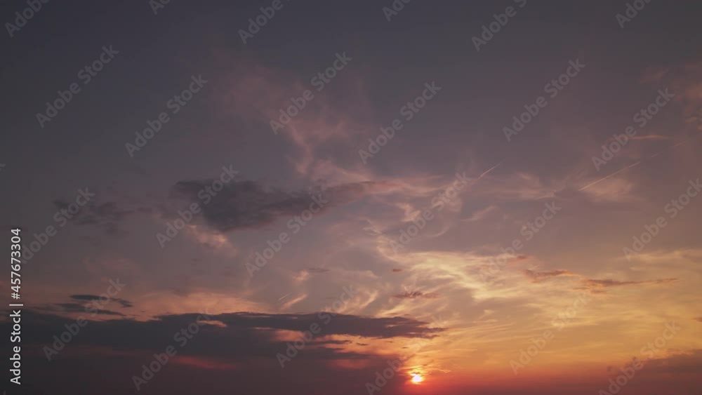Skyscape colored with sunrays. Cloudy flight at sundown. Bird's eye view at sunrise. The sunset with clouds and a sunlight shining. Saturated view of the dawn sky with orange and red colors. Skyscape colored with sunrays. Cloudy flight at sundown. Bird's eye view at sunrise. The sunset with clouds and a sunlight shining. Saturated view of the dawn sky with orange and red colors.