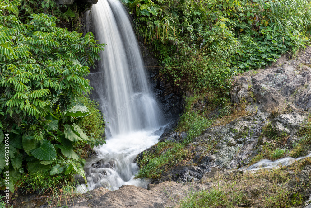 The water in the river forms a small waterfall