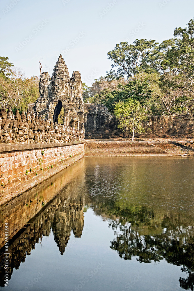 Fototapeta premium ancient sculptures on south gate bridge at Angkor Wat in Cambodia
